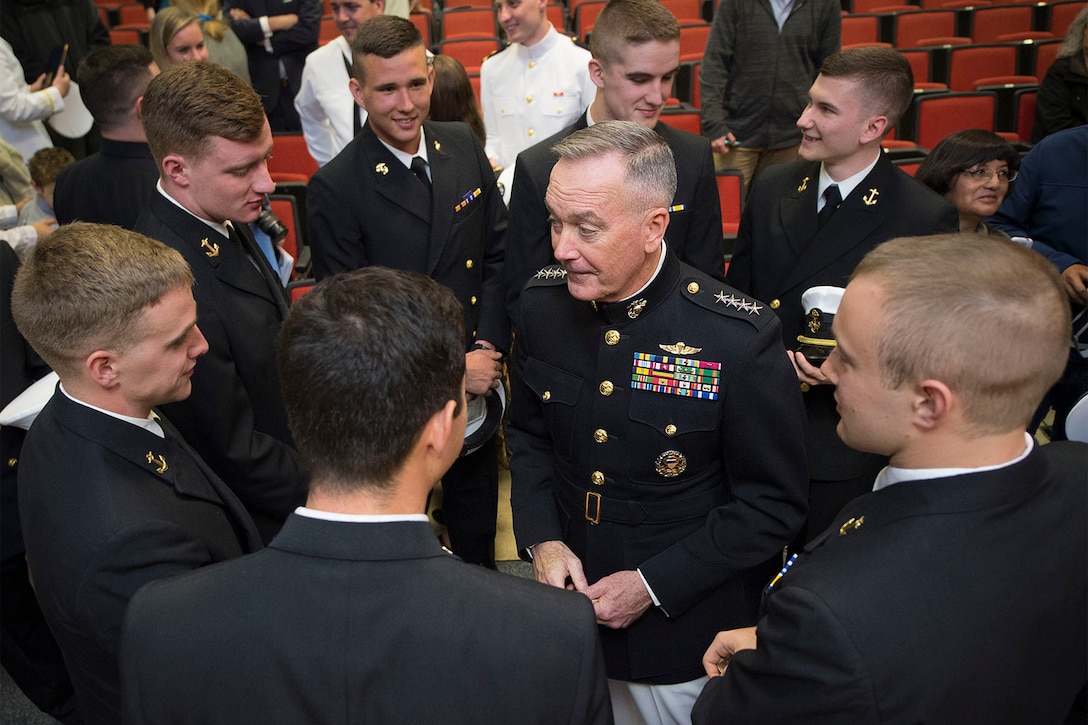 Marine Corps Gen. Joe Dunford, center, chairman of the Joint Chiefs of Staff, speaks with Maine Maritime Academy Naval ROTC midshipmen following a commissioning ceremony in Castine, Maine, May 7, 2016. DoD photo by Navy Petty Officer 2nd Class Dominique A. Pineiro