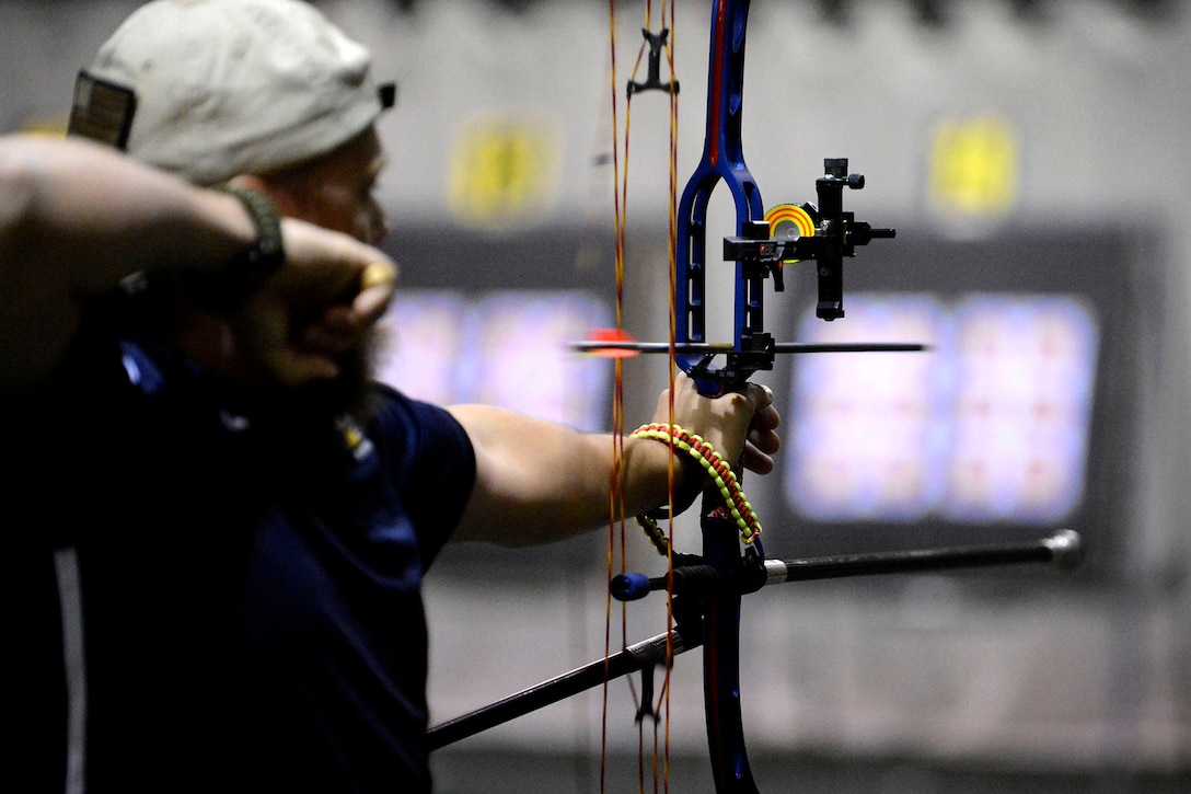 Team USA's Marine Corps Sgt. Clayton McDaniel releases an arrow during practice for the archery preliminary rounds at the 2016 Invictus Games in Orlando, Fla., May 8, 2016. More than 500 wounded, ill and injured service members from 15 nations will compete in this week's Invictus Games. Air Force photo by Staff Sgt. Carlin Leslie