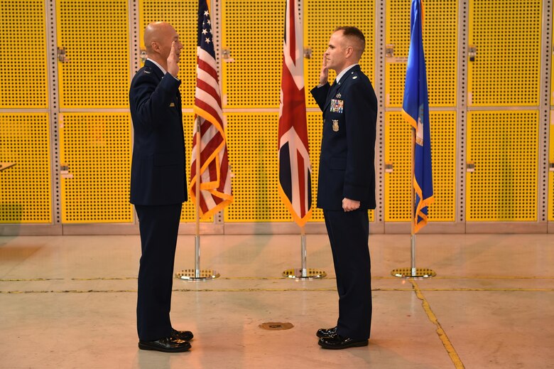 Lt. Col. Gibb Little, commander 423rd Civil Engineer Squadron, recites after Col. Young Yu, commander 423rd Air Base Group, at his promotion ceremony, April 1, 2016, at RAF Alconbury. Little has had five assignments and has deployed twice during his time in the U.S. Air Force.