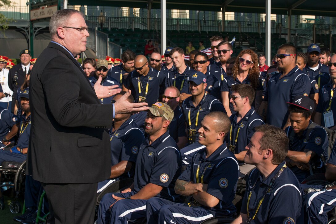 Deputy Defense Secretary Bob Work speaks to the U.S. team before the opening ceremony for Invictus Games 2016 at the ESPN Wide World of Sports Complex at Walt Disney World in Orlando, Fla., May 8, 2016. The competition brings together wounded veterans from 14 nations for events including track and field, archery, wheelchair basketball, road cycling, indoor rowing, wheelchair rugby, swimming, sitting volleyball and a driving challenge. DoD photo by Roger Wollenberg