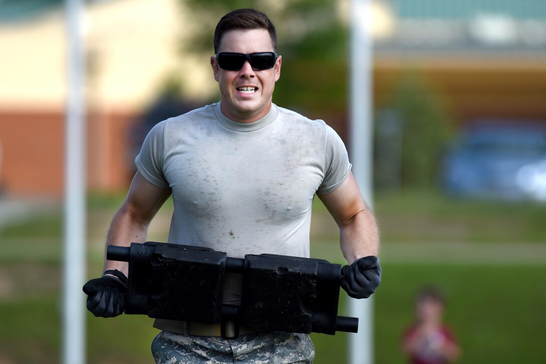 Army Sgt. Curtis Bowen carries a section of tank track from one location to another during the Track Block Shuffle event of the Gen. Gordon Sullivan Cup best tank crew competition at Fort Benning, Ga., May 1, 2016. Bowen is assigned to the North Carolina Army National Guard’s Company C, 1st Battalion, 252nd Armor Regiment. Army photo by Sgt. 1st Class Jon Soucy