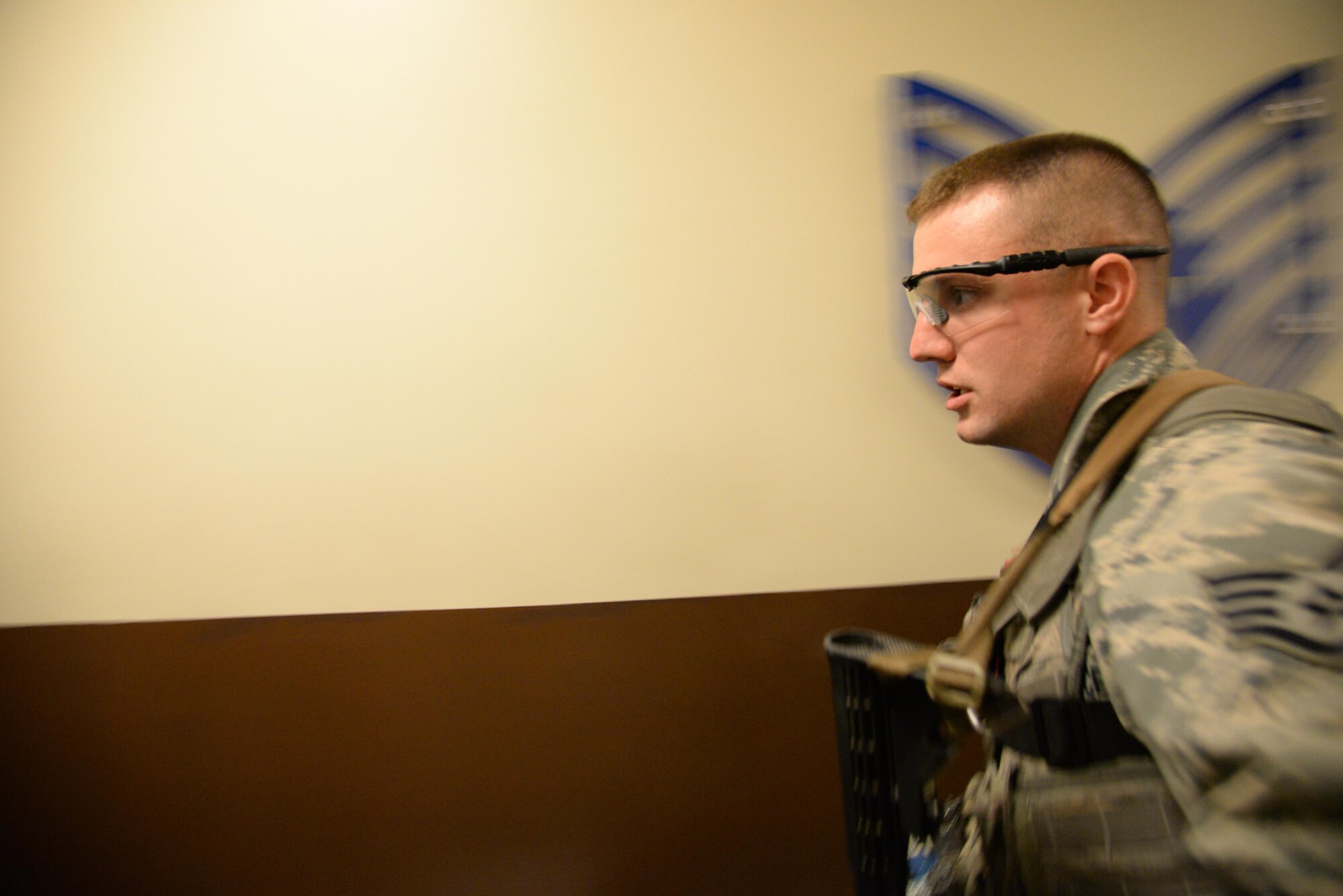 Staff Sgt. Kyle Hart, 51st Security Forces Squadron patrolman, searches for simulated victims during an active shooter exercise at Osan Air Base, Republic of Korea, May 6, 2016. The scenario kicked off the week-long readiness exercise, Beverly Herd 16-01. (U.S. Air Force photo by Tech. Sgt. Travis Edwards/Released)