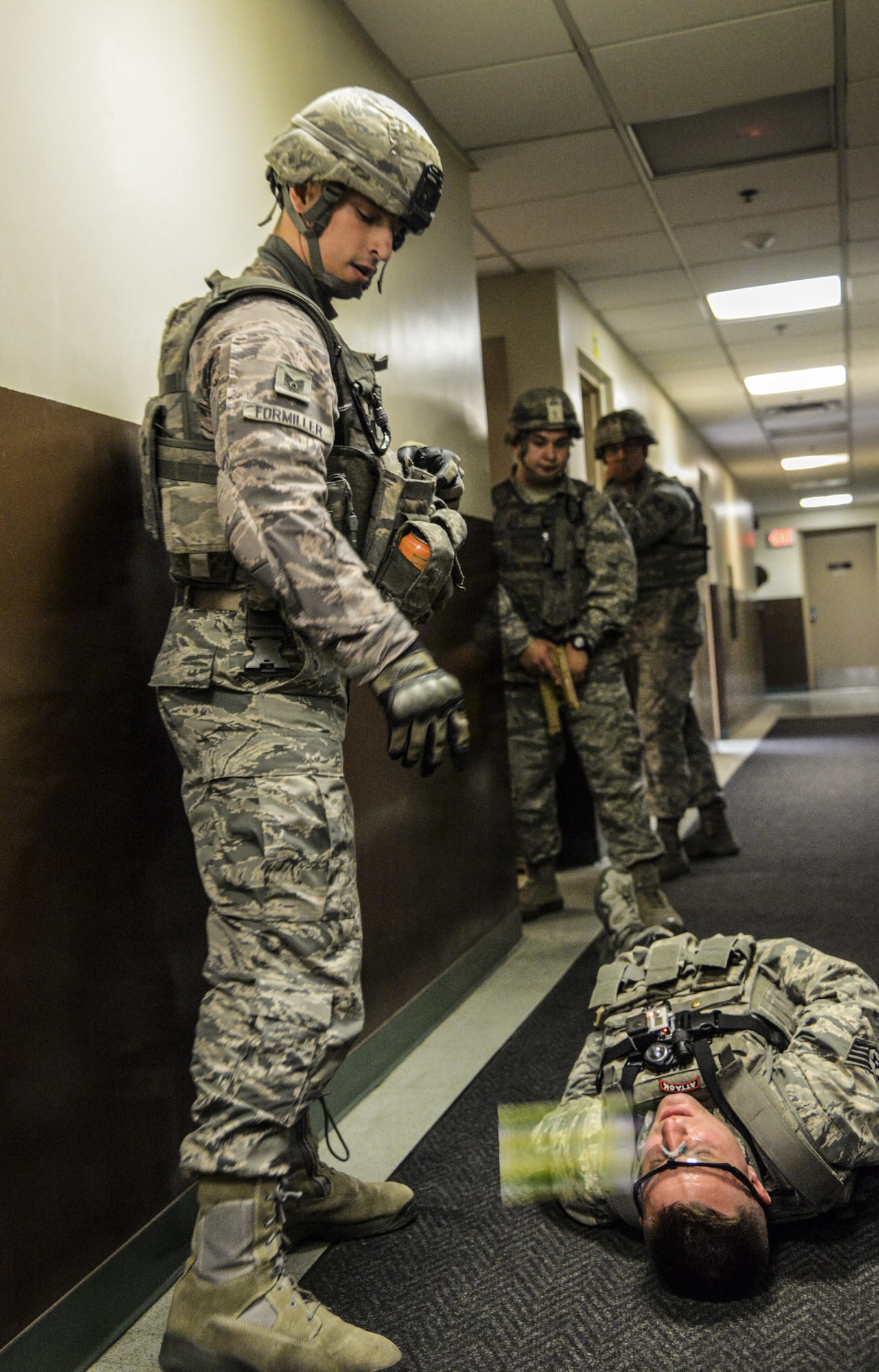 Staff Sgt. Patrick Formiller, 51st Security Forces Squadron first responder, marks simulated evidence with a glow stick during an active shooter exercise at Osan Air Base, Republic of Korea, May 6, 2016. Osan’s defenders responded to test their ability to neutralize an active shooter. (U.S. Air Force photo by Tech. Sgt. Travis Edwards/Released)