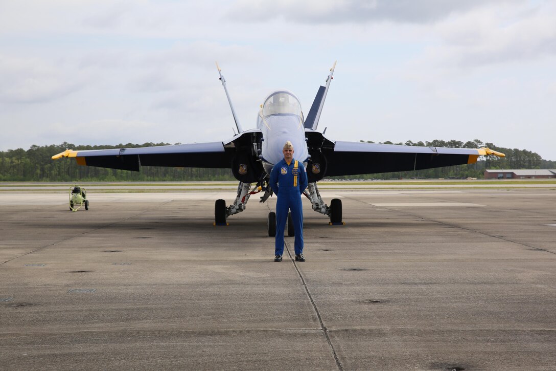 A U.S. Navy Blue Angels polot stands in front of his jet before the 2016 MCAS Cherry Point Air Show – “Celebrating 75 Years” at Marine Corps Air Station Cherry Point, N.C., April 28, 2016. The U.S. Navy Blue Angels showcase the pride and professionalism of the Navy and the Marine Corps by inspiring a culture of excellence and service to country through flight demonstrations and community outreach. This year’s air show celebrated MCAS Cherry Point and 2nd Marine Aircraft Wing’s 75th anniversary and featured 40 static displays, 17 aerial performers, as well as a concert. (U.S. Marine Corps photo by Lance Cpl. Mackenzie Gibson/Released)