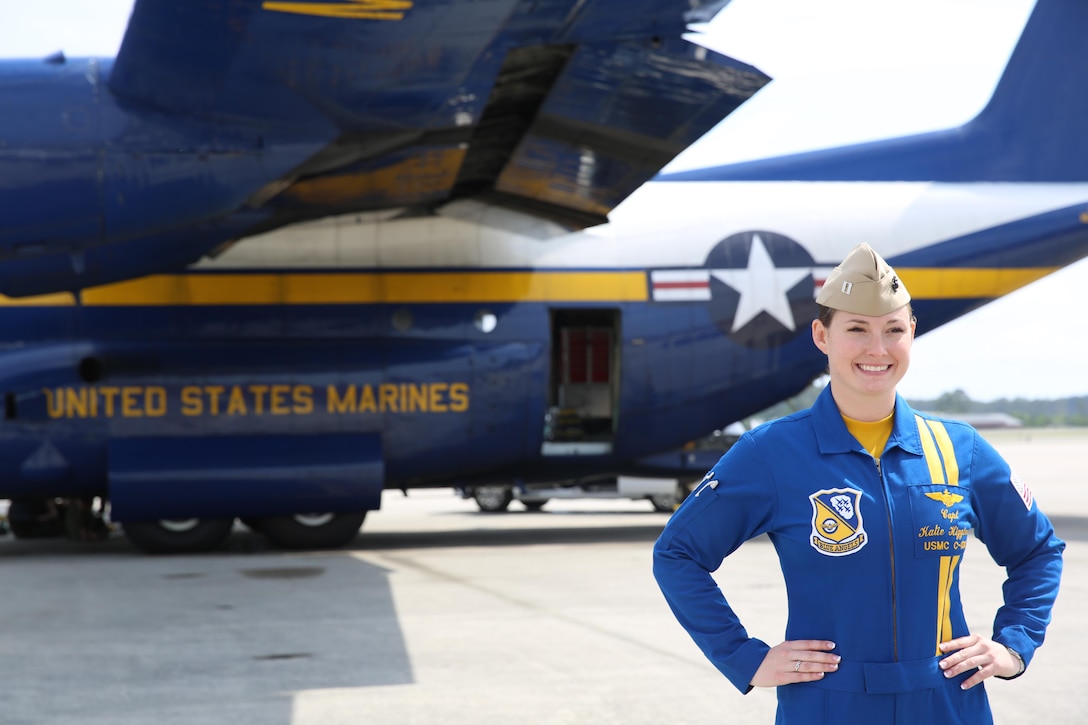 Capt. Katie Higgins poses in front of "Fat Albert", the U.S. Navy Blue Angel's C-130J Super Hercules prior to the 2016 Marine Corps Air Station Cherry Point Air Show -- "Celebrating 75 Years" at MCAS Cherry Point, N.C., April 28, 2016.The U.S. Navy Blue Angels showcase the pride and professionalism of the Navy and the Marine Corps by inspiring a culture of excellence and service to country through flight demonstrations and community outreach. This year’s air show celebrated MCAS Cherry Point and 2nd Marine Aircraft Wing’s 75th anniversary and featured 40 static displays, 17 aerial performers, as well as a concert. Higgins is the pilot for Fat Albert. (U.S. Marine Corps photo by Lance Cpl. Mackenzie Gibson/Released)