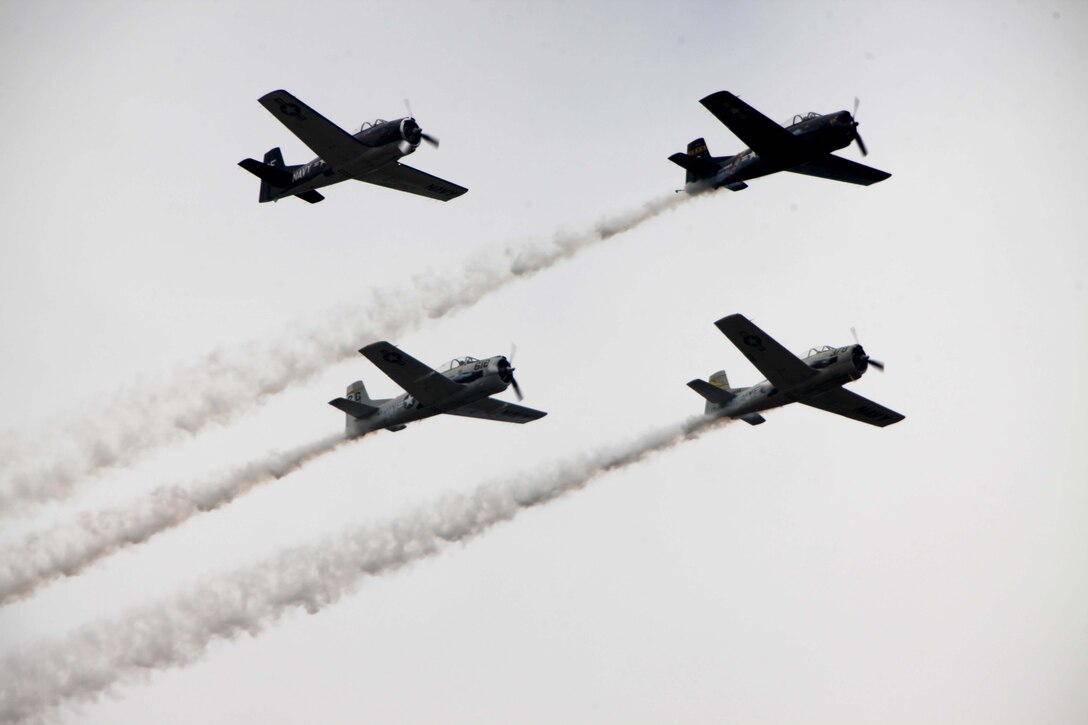 The P-51 Mustang Heritage Flight honors members of the armed forces during its flight at the 2016 MCAS Cherry Point Air Show – “Celebrating 75 Years” at Marine Corps Air Station Cherry Point, N.C., April 29, 2016.
The P-51 Mustang Heritage Flight featured the current fighter and attack aircraft flying with World War II, Korea and Vietnam era fighters, who use flight to honor the brave men and women in the U.S. Air Force. This year’s air show celebrated MCAS Cherry Point and 2nd Marine Aircraft Wing’s 75th anniversaries and featured 40 static displays, 17 aerial performers and a concert.
