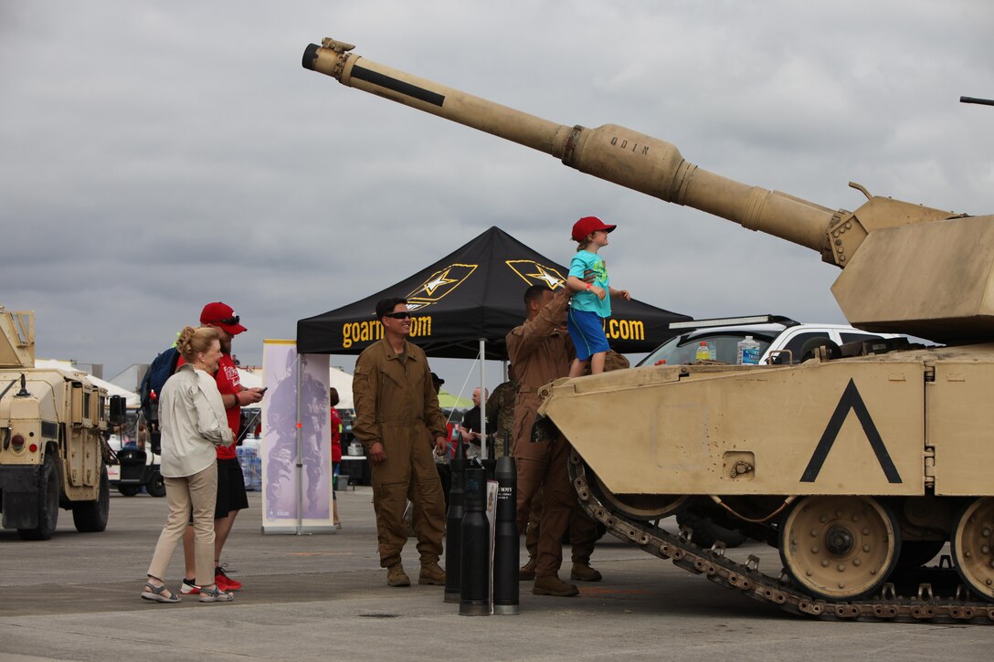 Marines, Sailors and civilian air show patrons view static displays of aircraft and weapons during the 2016 MCAS Cherry Point Air Show --  "Celebrating 75 Years" at Marine Corps Air Station Cherry Point, N.C., April 29, 30 and May 1, 2016. This years air show celebrated the 75th anniversary of 2nd Marine Aircraft Wing and MCAS Cherry Point and featured 40 static displays and 17 aerial performers. 