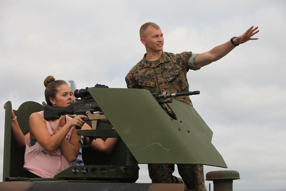 A Marine describes the functions of a weapon to an air show patron during the 2016 MCAS Cherry Point Air Show --  "Celebrating 75 Years" at Marine Corps Air Station Cherry Point, N.C., April 29, 30 and May 1, 2016. This years air show celebrated the 75th anniversary of 2nd Marine Aircraft Wing and MCAS Cherry Point and featured 40 static displays and 17 aerial performers. 