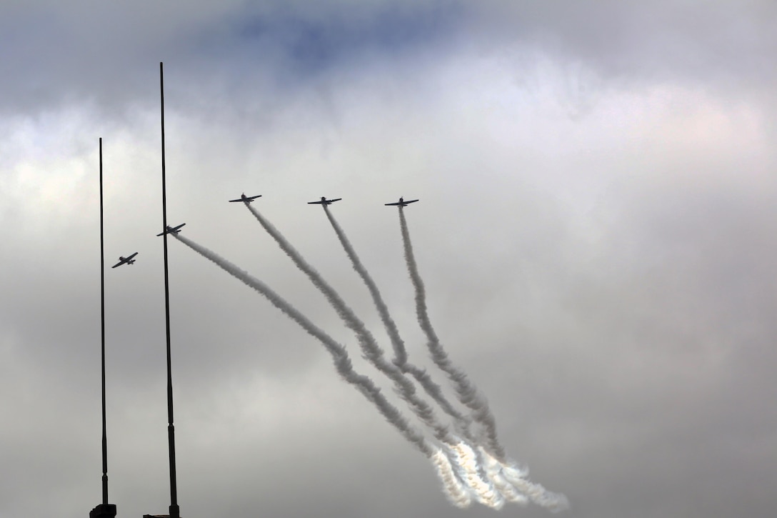 The Trojan Horsemen formation proves to be an unforgettable experience for patrons at the 2016 Marine Corps Air Station Cherry Point Air Show – “Celebrating 75 Years” at MCAS Cherry Point, N.C., April 29, 2016.
The Trojan Horsemen are a T-28 Warbird Formation Aerobatic Demo Team is the only six-ship T-28 Warbird formation demonstration team performing in the world today. This year’s air show celebrated MCAS Cherry Point and 2nd Marine Aircraft Wing’s 75th anniversary and is as much fun on the ground as it is in the air featuring 40 static displays, 17 aerial performers, as well as a concert. (U.S. Marine Corps photo by Lance Cpl. Mackenzie Gibson/ Released)
