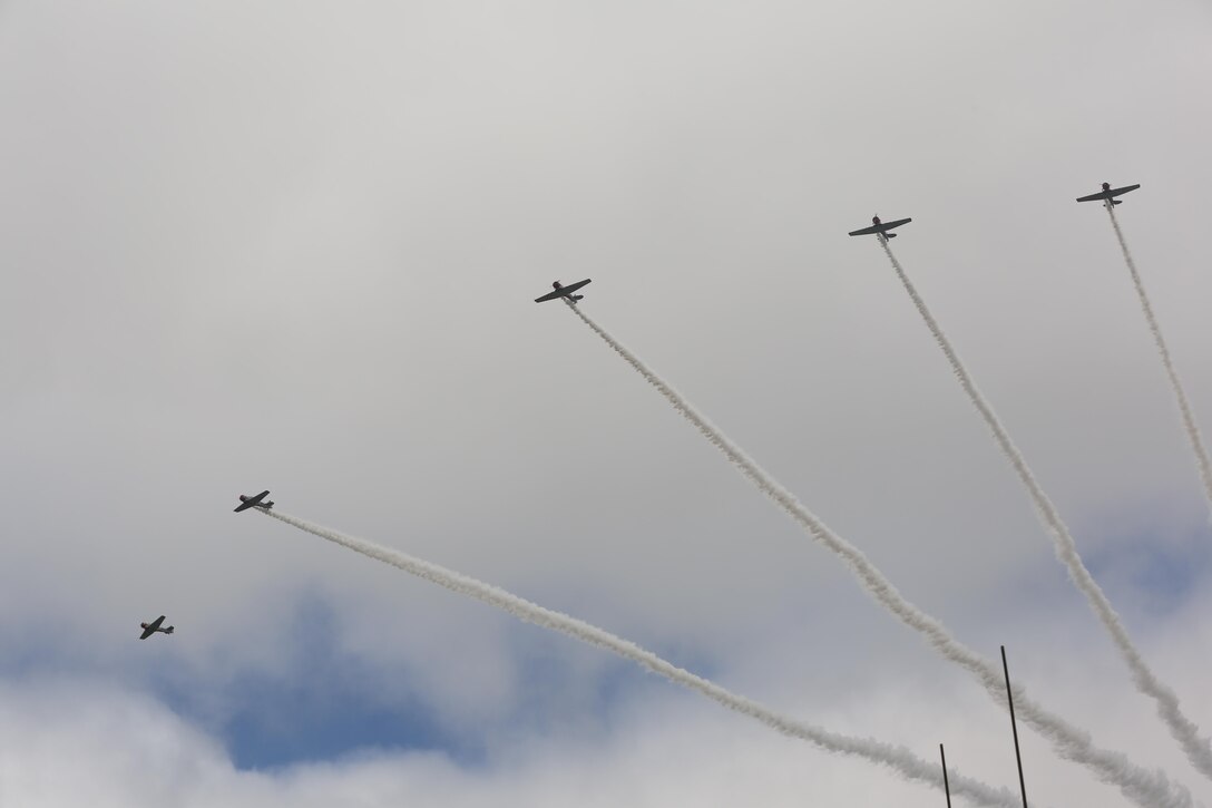 The Trojan Horsemen formation proves to be an unforgettable experience for patrons at the 2016 Marine Corps Air Station Cherry Point Air Show – “Celebrating 75 Years” at MCAS Cherry Point, N.C., April 29, 2016.
The Trojan Horsemen are a T-28 Warbird Formation Aerobatic Demo Team is the only six-ship T-28 Warbird formation demonstration team performing in the world today. This year’s air show celebrated MCAS Cherry Point and 2nd Marine Aircraft Wing’s 75th anniversary and is as much fun on the ground as it is in the air featuring 40 static displays, 17 aerial performers, as well as a concert. (U.S. Marine Corps photo by Lance Cpl. Mackenzie Gibson/ Released)
