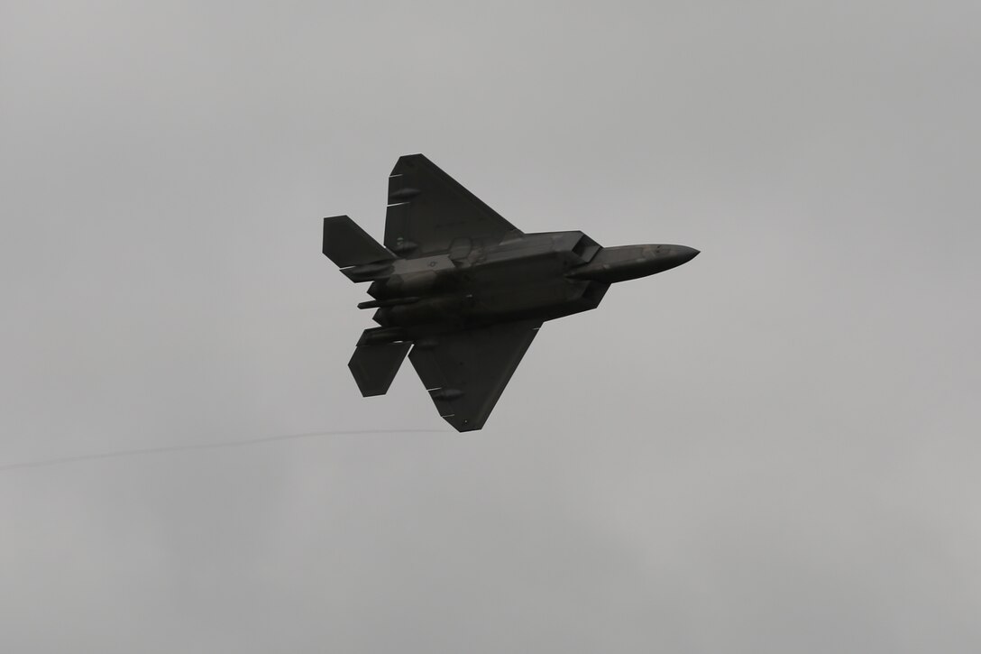 A U.S. Air Force F-22 Raptor rumbles the ground and amazes airshow patrons at the 2016 Marine Corps Air Station Cherry Point Air Show – “Celebrating 75 Years” at MCAS Cherry Point, N.C., April 29, 2016. The Air Force’s F-22 Raptor combines sensor capabilities with integrated avionics, situational awareness and weapons to provide the first-kill opportunity against threats by performing air-to-air and air-to-ground missions. This year’s air show celebrated MCAS Cherry Point and 2nd Marine Aircraft Wing’s 75th anniversary and featured 40 static displays, 17 aerial performers, as well as a concert. (U.S. Marine Corps photo by Lance Cpl. Mackenzie Gibson/Released)
