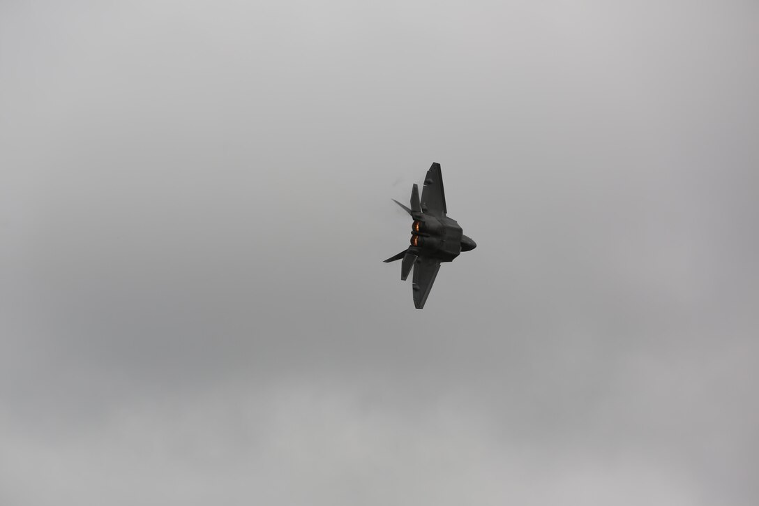 A U.S. Air Force F-22 Raptor rumbles the ground and amazes airshow patrons at the 2016 Marine Corps Air Station Cherry Point Air Show – “Celebrating 75 Years” at MCAS Cherry Point, N.C., April 29, 2016. The Air Force’s F-22 Raptor combines sensor capabilities with integrated avionics, situational awareness and weapons to provide the first-kill opportunity against threats by performing air-to-air and air-to-ground missions. This year’s air show celebrated MCAS Cherry Point and 2nd Marine Aircraft Wing’s 75th anniversary and featured 40 static displays, 17 aerial performers, as well as a concert. (U.S. Marine Corps photo by Lance Cpl. Mackenzie Gibson/Released)
