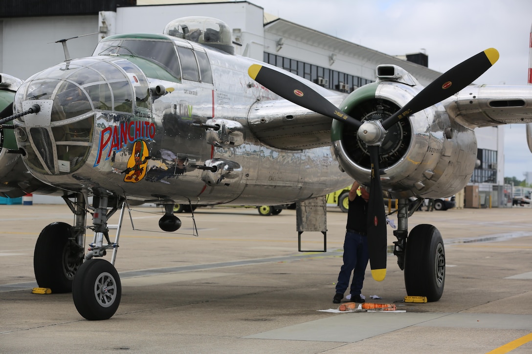 Paul Nuwer, the pilot for the B-52 Bomber "Panchito", cleans his plane on the flight line at the 2016 Marine Corps Air Station Cherry Point Air Show -- "Celebrating 75 Years" at MCAS Cherry Point, N.C., April 29, 2016. The North American B25 was among the famous twin engine medium bombers used during World War II. (U.S. Marine Corps photo by Lance Cpl. Mackenzie Gibson/ Released)