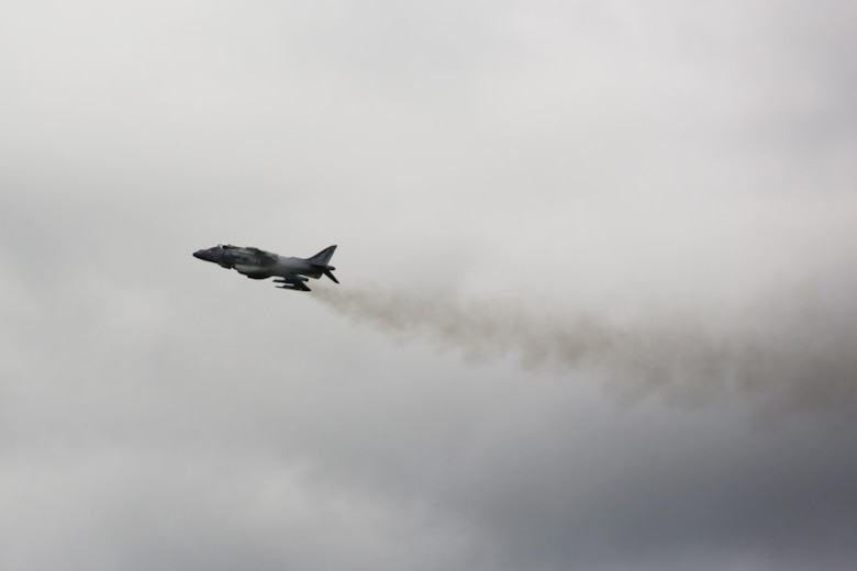 An AV-8B Harrier II speeds past the crowd at the 2016 Marine Corps Air Station Cherry Point Air Show – “Celebrating 75 Years” at MCAS Cherry Point, N.C., April 29, 2016. The AV-8B Harrier II represents the Marine Corps advanced capabilities through its short, vertical takeoff and landing capabilities with the ability to hover like a helicopter and accelerate forward like a jet at near supersonic speeds by use of its VSTOL engines producing 22,000 pounds of thrust. This year’s air show celebrated MCAS Cherry Point and 2nd Marine Aircraft Wing’s 75th anniversary and featured 40 static displays, 17 aerial performers with something fun for all ages including great food, a concert, fireworks and a kids fun zone. (U.S. Marine Corps photo by Lance Cpl. Mackenzie Gibson/ Released)