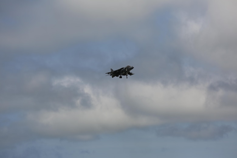 An AV-8B Harrier II hovers above the crowd at the 2016 Marine Corps Air Station Cherry Point Air Show – “Celebrating 75 Years” at MCAS Cherry Point, N.C., April 29, 2016. The AV-8B Harrier II represents the Marine Corps advanced capabilities through its short, vertical takeoff and landing capabilities with the ability to hover like a helicopter and accelerate forward like a jet at near supersonic speeds by use of its VSTOL engines producing 22,000 pounds of thrust. This year’s air show celebrated MCAS Cherry Point and 2nd Marine Aircraft Wing’s 75th anniversary and featured 40 static displays, 17 aerial performers with something fun for all ages including great food, a concert, fireworks and a kids fun zone. (U.S. Marine Corps photo by Lance Cpl. Mackenzie Gibson/ Released)