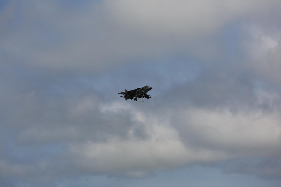 An AV-8B Harrier II hovers above the crowd at the 2016 Marine Corps Air Station Cherry Point Air Show – “Celebrating 75 Years” at MCAS Cherry Point, N.C., April 29, 2016. The AV-8B Harrier II represents the Marine Corps advanced capabilities through its short, vertical takeoff and landing capabilities with the ability to hover like a helicopter and accelerate forward like a jet at near supersonic speeds by use of its VSTOL engines producing 22,000 pounds of thrust. This year’s air show celebrated MCAS Cherry Point and 2nd Marine Aircraft Wing’s 75th anniversary and featured 40 static displays, 17 aerial performers with something fun for all ages including great food, a concert, fireworks and a kids fun zone. (U.S. Marine Corps photo by Lance Cpl. Mackenzie Gibson/ Released)