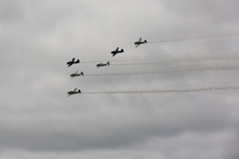 The Trojan Horsemen formation proves to be an unforgettable experience for patrons at the 2016 Marine Corps Air Station Cherry Point Air Show – “Celebrating 75 Years” at MCAS Cherry Point, N.C., April 29, 2016.
The Trojan Horsemen are a T-28 Warbird Formation Aerobatic Demo Team is the only six-ship T-28 Warbird formation demonstration team performing in the world today. This year’s air show celebrated MCAS Cherry Point and 2nd Marine Aircraft Wing’s 75th anniversary and is as much fun on the ground as it is in the air featuring 40 static displays, 17 aerial performers, as well as a concert. (U.S. Marine Corps photo by Lance Cpl. Mackenzie Gibson/ Released)
