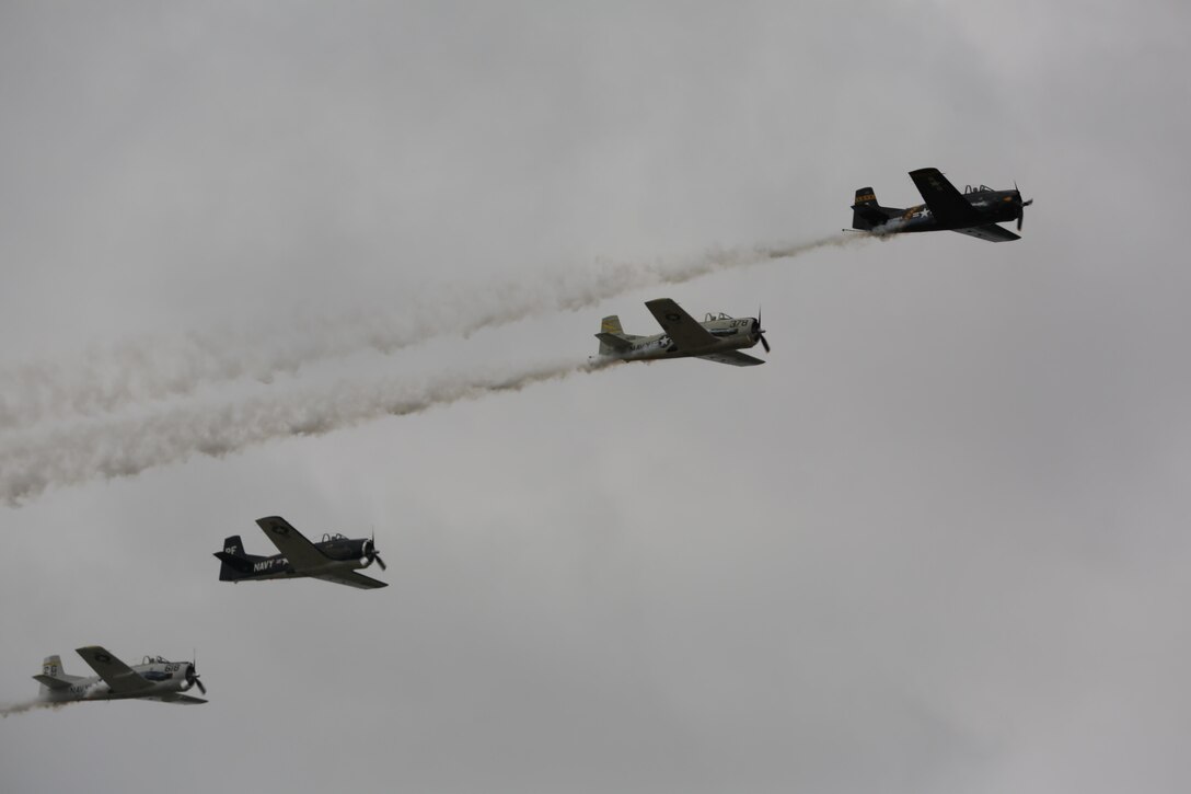 The Trojan Horsemen formation proves to be an unforgettable experience for patrons at the 2016 Marine Corps Air Station Cherry Point Air Show – “Celebrating 75 Years” at MCAS Cherry Point, N.C., April 29, 2016.
The Trojan Horsemen are a T-28 Warbird Formation Aerobatic Demo Team is the only six-ship T-28 Warbird formation demonstration team performing in the world today. This year’s air show celebrated MCAS Cherry Point and 2nd Marine Aircraft Wing’s 75th anniversary and is as much fun on the ground as it is in the air featuring 40 static displays, 17 aerial performers, as well as a concert. (U.S. Marine Corps photo by Lance Cpl. Mackenzie Gibson/ Released)
