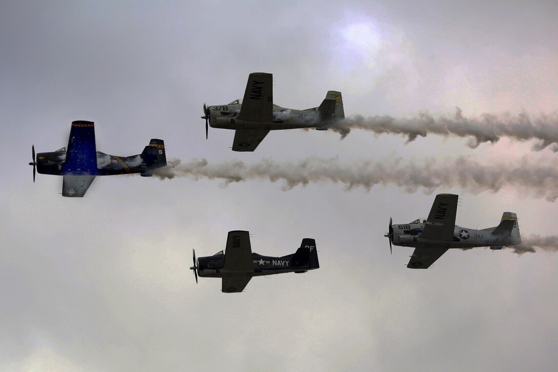 The Trojan Horsemen formation proves to be an unforgettable experience for patrons at the 2016 Marine Corps Air Station Cherry Point Air Show – “Celebrating 75 Years” at MCAS Cherry Point, N.C., April 29, 2016.
The Trojan Horsemen are a T-28 Warbird Formation Aerobatic Demo Team is the only six-ship T-28 Warbird formation demonstration team performing in the world today. This year’s air show celebrated MCAS Cherry Point and 2nd Marine Aircraft Wing’s 75th anniversary and is as much fun on the ground as it is in the air featuring 40 static displays, 17 aerial performers, as well as a concert. (U.S. Marine Corps photo by Lance Cpl. Mackenzie Gibson/ Released)
