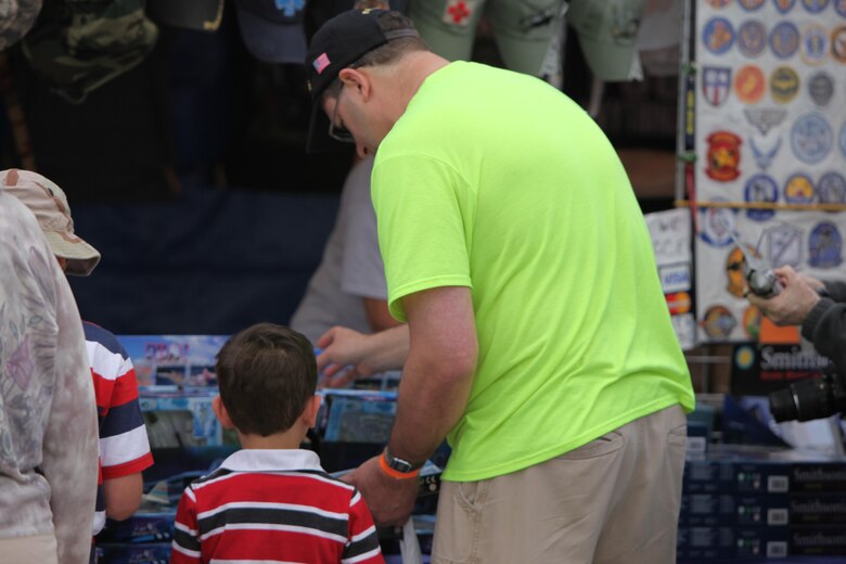 Vendors sell products and goods at tents and stands at the 2016 MCAS Cherry Point Air Show – “Celebrating 75 Years” at Marine Corps Air Station Cherry Point, N.C., April 29, 30 and May 1 2016. This year’s air show celebrated MCAS Cherry Point and 2nd Marine Aircraft Wing’s 75th anniversaries and featured 40 static displays, 17 aerial performers and a concert.