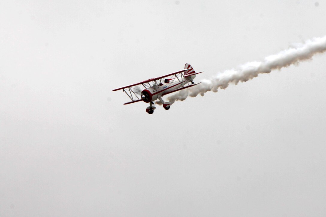 The PT-17 Stearman displays its great power while conducting a demonstration at the 2016 MCAS Cherry Point Air Show – “Celebrating 75 Years” at Marine Corps Air Station Cherry Point, N.C., April 30, 2016.
The PT-17 Stearman is powered by a nine-cylinder, 450 horsepower Pratt and Whitney Wasp engine, began as a basic flight trainer for the U.S. Army Air Corps in 1942. Since then, the aircraft was reconstructed to be faster and capable of inverted flight. This year’s air show celebrated MCAS Cherry Point and 2nd Marine Aircraft Wing’s 75th anniversaries and featured 40 static displays, 17 aerial performers and a concert.