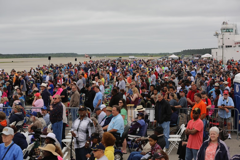 Spectators watch in awe as performars soar through the sky at the 2016 Marine Corps Air Station Cherry Point Air Show – “Celebrating 75 Years” at MCAS Cherry Point, N.C., April 30, 2016. This year’s air show celebrated MCAS Cherry Point and 2nd Marine Aircraft Wing’s 75th anniversary and featured 40 static displays, 17 aerial performers, as well as a concert. (U.S. Marine Corps photo by Lance Cpl. Mackenzie Gibson/Released)