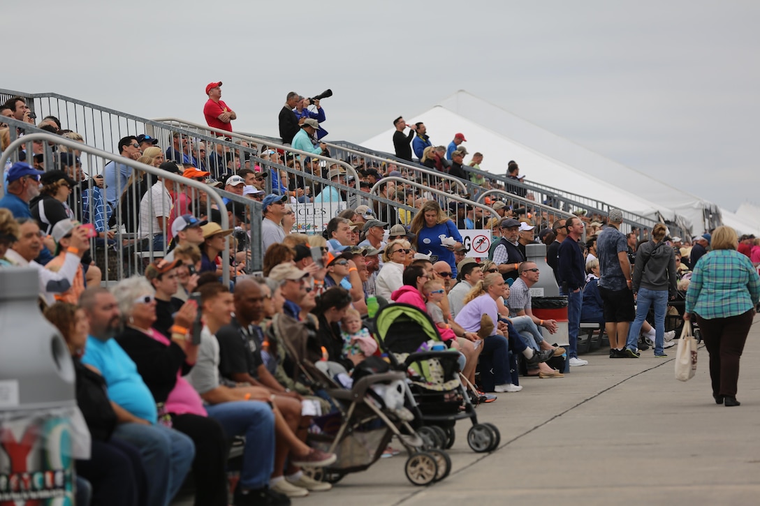 Spectators watch in awe as performars soar through the sky at the 2016 Marine Corps Air Station Cherry Point Air Show – “Celebrating 75 Years” at MCAS Cherry Point, N.C., April 30, 2016. This year’s air show celebrated MCAS Cherry Point and 2nd Marine Aircraft Wing’s 75th anniversary and featured 40 static displays, 17 aerial performers, as well as a concert. (U.S. Marine Corps photo by Lance Cpl. Mackenzie Gibson/Released)