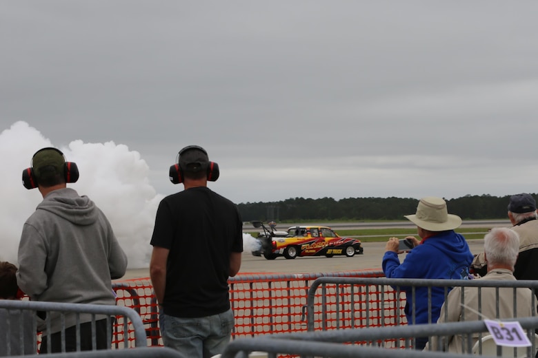 The Flash Fire jet truck speeds past spectators at the 2016 Marine Corps Air Station Cherry Point Air Show - "Celebrating 75 Years" at MCAS Cherry Point, N.C., April 30, 2016. The Flash Fire Jet Truck has a fire breathing 12,000 horsepower jet engine and reaches speeds exceeding 350 mph. This year’s air show celebrated MCAS Cherry Point and 2nd Marine Aircraft Wing’s 75th anniversary and is as much fun on the ground as it is in the air featuring 40 static displays, 17 aerial performers, as well as a concert. (U.S. Marine Corps photo by Lance Cpl. Mackenzie Gibson/ Released)