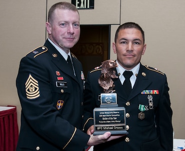 Spc. Michael Orozco, 416th Theater Engineer Command and the 2016 U.S. Army Reserve Soldier of the Year, stands with the USAR Interim Command Sgt. Maj. James P. Wills at the awards banquet May 6. The 2016 USAR BWC held May 2-4 at Fort Bragg, N.C., determined the top noncommissioned officer and junior enlisted Soldier to represent the U.S. Army Reserve in the Department of the Army Best Warrior Competition later this year at Fort A.P. Hill, Va. (U.S. Army photo by Sgt. Darryl Montgomery) (Released)