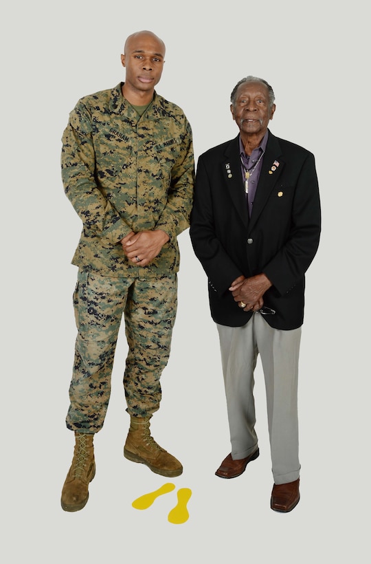 Sgt. Frederick Graham (left), heavy equipment engineer maintenance chief, Organic Maintenance Unit, Marine Corps Logistics Command, meets one of the original Montford Point Marines, Henry L. Jackson, a World War II veteran and retired U.S. Air Force master sergeant. Jackson, a Congressional Gold Medal recipient, was one of the 20,000 African-American Marines to attend basic training at Montford Point, North Carolina, on a mandate from then-President Franklin D. Roosevelt, during the period between 1942 and 1949. Jackson and Graham, who recently met, shared some of their experiences in the Marine Corps.