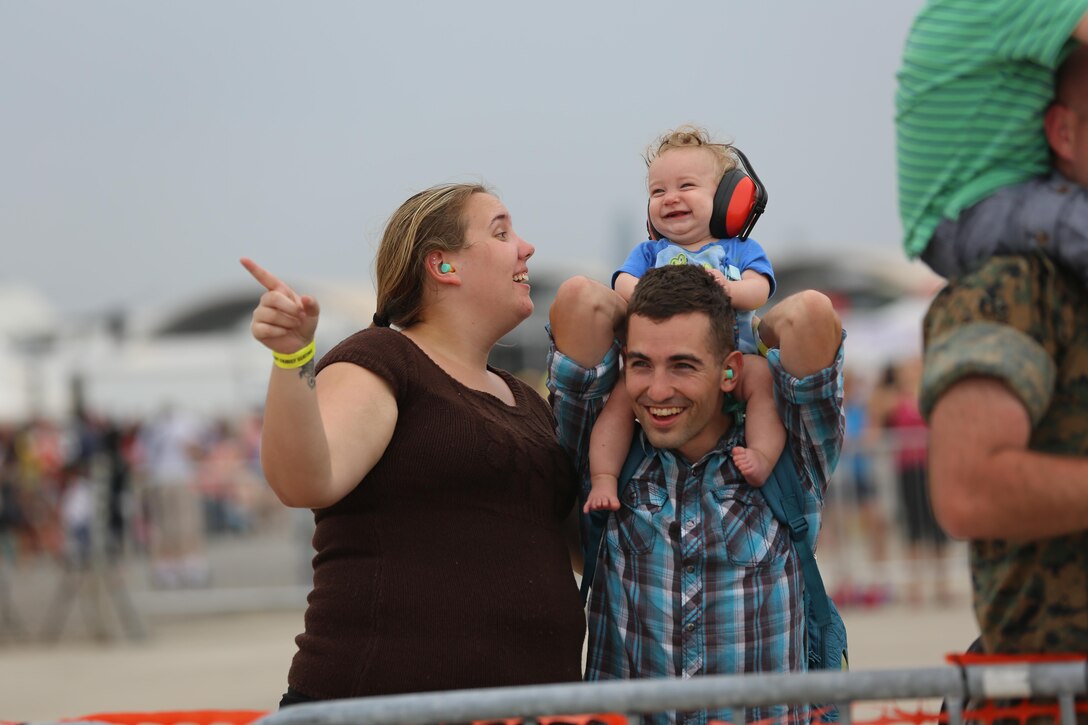 A family enjoys watching the U.S. Navy Blue Angels perform at the 2016 Marine Corps Air Station Cherry Point Air Show – “Celebrating 75 Years” at MCAS Cherry Point, N.C., May 1, 2016. This year’s air show celebrated MCAS Cherry Point and 2nd Marine Aircraft Wing’s 75th anniversaries and featured 40 static displays, 17 aerial performers and a concert. (U.S. Marine Corps photo by Lance Cpl. Mackenzie Gibson/ Released)