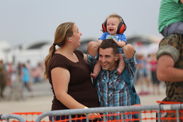 A family enjoys watching the U.S. Navy Blue Angels perform at the 2016 Marine Corps Air Station Cherry Point Air Show – “Celebrating 75 Years” at MCAS Cherry Point, N.C., May 1, 2016. This year’s air show celebrated MCAS Cherry Point and 2nd Marine Aircraft Wing’s 75th anniversaries and featured 40 static displays, 17 aerial performers and a concert. (U.S. Marine Corps photo by Lance Cpl. Mackenzie Gibson/ Released)