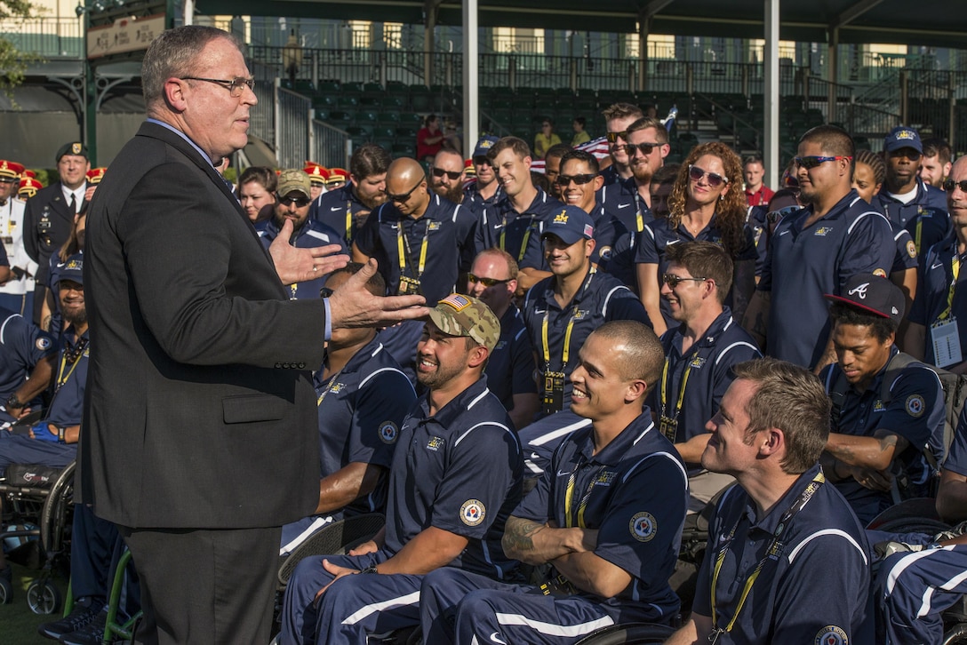 Deputy Defense Secretary Bob Work speaks to the U.S. team before the opening ceremony for Invictus Games 2016 at the ESPN Wide World of Sports complex at Walt Disney World in Orlando, Fla., May 8, 2016. The competition is the United Kingdom’s version of the Warrior Games, bringing together wounded veterans from 14 nations for events, including track and field, archery, wheelchair basketball, road cycling, indoor rowing, wheelchair rugby, swimming, sitting volleyball and a driving challenge. DoD photo by Roger Wollenberg