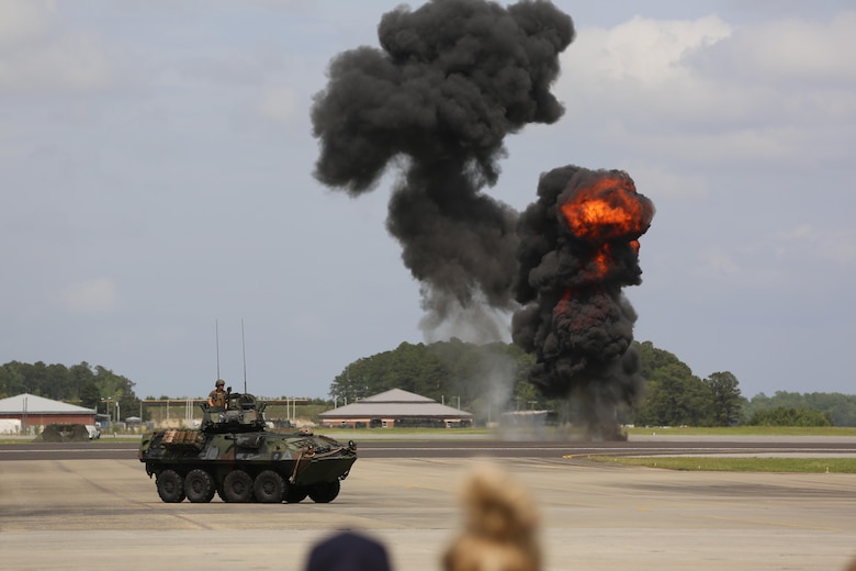 The Marine Air-Ground Task Force performs high speed demonstration on the flight line at the 2016 Marine Corps Air Station Cherry Point Air Show – “Celebrating 75 Years” at MCAS Cherry Point, N.C., May 1, 2016. The Marine Air-Ground Task Force is designed for swift deployment of Marine forces by air, land or sea. This year’s air show celebrated MCAS Cherry Point and 2nd Marine Aircraft Wing’s 75th anniversaries and featured 40 static displays, 17 aerial performers and a concert. (U.S. Marine Corps photo by Lance Cpl. Mackenzie Gibson/ Released)
