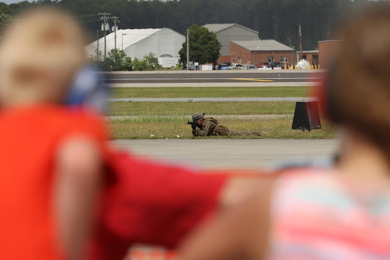 The Marine Air-Ground Task Force performs high speed demonstration on the flight line at the 2016 Marine Corps Air Station Cherry Point Air Show – “Celebrating 75 Years” at MCAS Cherry Point, N.C., May 1, 2016. The Marine Air-Ground Task Force is designed for swift deployment of Marine forces by air, land or sea. This year’s air show celebrated MCAS Cherry Point and 2nd Marine Aircraft Wing’s 75th anniversaries and featured 40 static displays, 17 aerial performers and a concert. (U.S. Marine Corps photo by Lance Cpl. Mackenzie Gibson/ Released)
