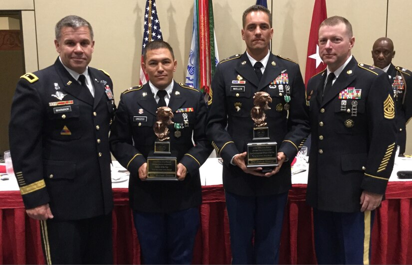 Spc. Michael S. Orozco, second from left, representing the 416th Theater Engineer Command, and Sgt. 1st Class Joshua Moeller, representing the 108th Training Command (Initial Entry Training), were named the Soldier and Noncommissioned Officer of the Year during an awards ceremony at the U.S. Army Reserve Best Warrior Competition, May 6, at the Iron Mike Conference Center, Fort Bragg, N.C. Orozco and Moeller will represent the U.S. Army Reserve at the Army Best Warrior Competition later this year at Fort A.P. Hill, Va. Pictured with Orozco and Moeller are Brig. Gen. Michael J. Warmack, left, U.S. Army Reserve Command G-3/5/7, and Command Sgt. Maj. James P. Wills, interim command sergeant major of the U.S. Army Reserve. (U.S. Army photo by Timothy L. Hale) (Released)