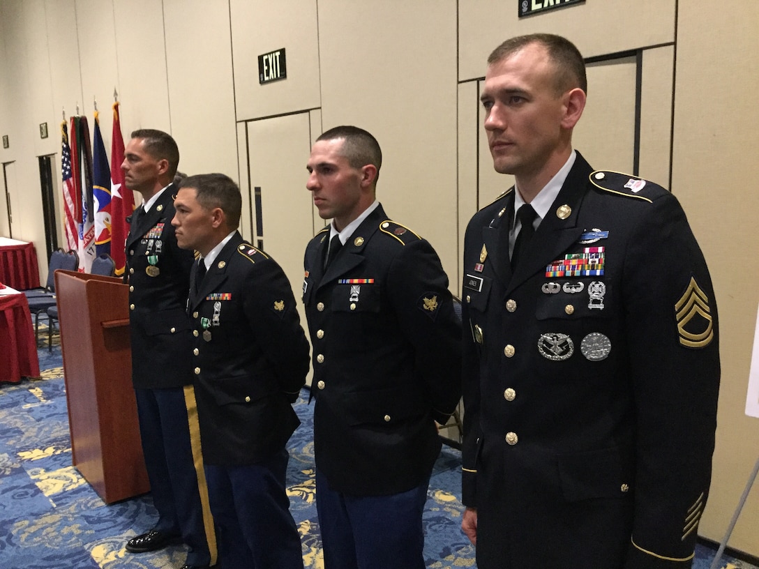 (L-R) Sgt. 1st Class Joshua Moeller, representing the 108th Training Command (Initial Entry Training), the 2016 U.S. Army Reserve Noncommissioned Officer of the Year, Spc. Michael S. Orozco, representing the 416th Theater Engineer Command, the 2016 U.S. Army Reserve Soldier of the Year, Spc. Carlo Deldonno, representing the 3rd Medical Command (Deployment Support), the Soldier of the Year runner-up, and Sgt. 1st Class Robert D. Jones, representing the Army Reserve Careers Division, the NCO of the Year runner-up. They were selected as the winners at the U.S. Army Reserve Best Warrior Competition, May 6, at the Iron Mike Conference Center, Fort Bragg, N.C. Orozco and Moeller will represent the U.S. Army Reserve at the Army Best Warrior Competition later this year at Fort A.P. Hill, Va. (U.S. Army photo by Timothy L. Hale) (Released)