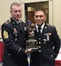 Spc. Michael S. Orozco, right, representing the 416th Theater Engineer Command, accepts the Soldier of the Year trophy from Command Sgt. Maj. James P. Wills, interim command sergeant major of the U.S. Army Reserve, at the U.S. Army Reserve Best Warrior Competition awards luncheon, May 6, at the Iron Mike Conference Center, Fort Bragg, N.C. Orozco will represent the U.S. Army Reserve at the Army Best Warrior Competition later this year at Fort A.P. Hill, Va. (U.S. Army photo by Timothy L. Hale) (Released)
