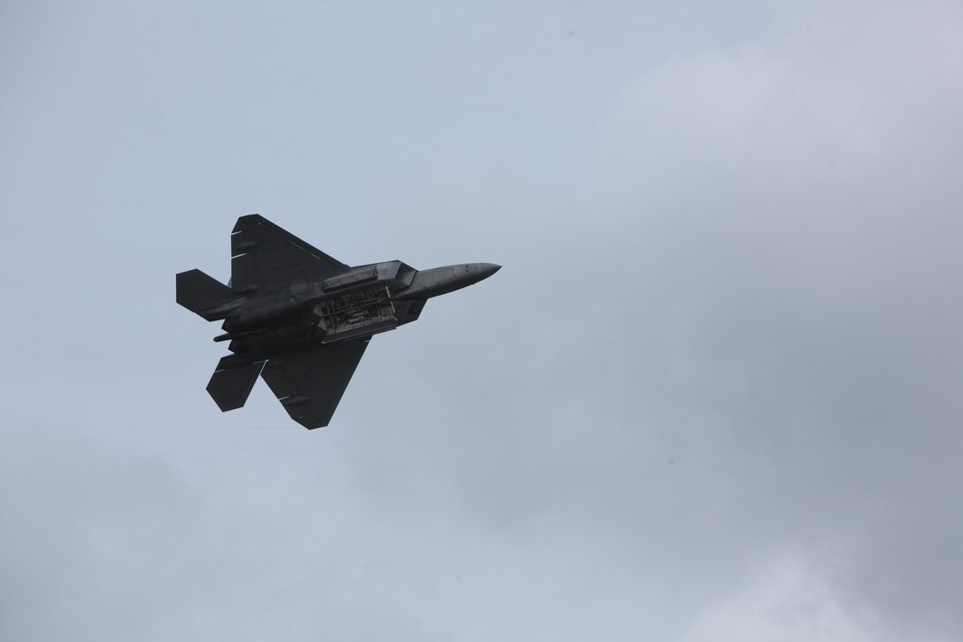 An F-22 Raptor soars through the sky and amazes airshow patrons at the 2016 Marine Corps Air Station Cherry Point Air Show – “Celebrating 75 Years” at MCAS Cherry Point, N.C., May 1, 2016. The Air Force’s F-22 Raptor combines sensor capabilities with integrated avionics, situational awareness and weapons to provide the first-kill opportunity against threats by performing air-to-air and air-to-ground missions. This year’s air show celebrated MCAS Cherry Point and 2nd Marine Aircraft Wing’s 75th anniversary and featured 40 static displays, 17 aerial performers, as well as a concert.