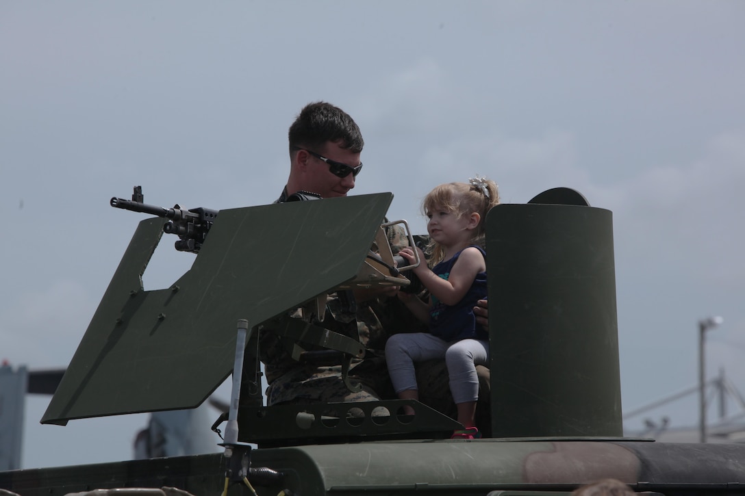 Marines, Sailors and civilian air show patrons view static displays of aircraft and weapons during the 2016 MCAS Cherry Point Air Show --  "Celebrating 75 Years" at Marine Corps Air Station Cherry Point, N.C., April 29, 30 and May 1, 2016. This years air show celebrated the 75th anniversary of 2nd Marine Aircraft Wing and MCAS Cherry Point and featured 40 static displays and 17 aerial performers.
