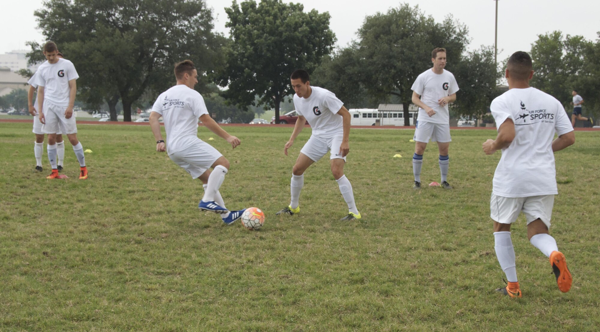 The All-Air Force men's soccer team practices April 29 at Joint Base San Antonio-Lackland, Texas. The team trained three times a day during the 2 1/2-week training camp. (U.S. Air Force photo/Steve Warns/Released)