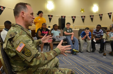 Maj. Gen. Patrick J. Reinert, 88th RSC commanding general, answers a question about deployment during the Yellow Ribbon Event in Bloomington, Minn., May 7. “Soldier Speak”, an 88th RSC Yellow Ribbon Program highlight, allows children of military families an opportunity to ask a Soldier questions and share concerns, challenges and stories. The children ranged in age from six to twelve years old. Reinert met the children’s curiosity with openness and honesty, sharing his own personal experiences and encouraging the children to talk about their concerns as well as their accomplishments. Reinert also presented each military child with an “All American Hero” award during a children’s program in honor of their unique strengths and sacrifices.