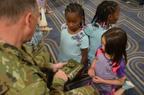 Maj. Gen. Patrick J. Reinert, 88th RSC commanding general, explains what the stars on his patch means to a classroom of military children during the Yellow Ribbon Event in Bloomington, Minn., May 7. “Soldier Speak”, an 88th RSC Yellow Ribbon Program highlight, allows children of military families an opportunity to ask a Soldier questions and share concerns, challenges and stories. The children ranged in age from six to twelve years old. Reinert met the children’s curiosity with openness and honesty, sharing his own personal experiences and encouraging the children to talk about their concerns as well as their accomplishments. Reinert also presented each military child with an “All American Hero” award during a children’s program in honor of their unique strengths and sacrifices.