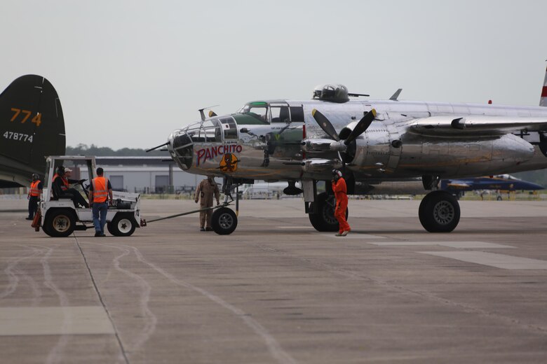 Marines, Sailors and civilians disassemble set-ups on the flight line following the 2016 Marine Corps Air Station Cherry Point Air Show -- "Celebrating 75 Years' at MCAS Cherry Point, N.C. The air show celebrated MCAS Cherry Point and 2nd Marine Aircraft Wing’s 75th anniversaries and featured 40 static displays, 17 aerial performers and a concert.