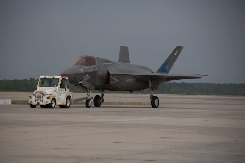 Marines, Sailors and civilians disassemble set-ups and displays on the flight line following the 2016 Marine Corps Air Station Cherry Point Air Show -- "Celebrating 75 Years' at MCAS Cherry Point, N.C. The air show celebrated MCAS Cherry Point and 2nd Marine Aircraft Wing’s 75th anniversaries and featured 40 static displays, 17 aerial performers and a concert.