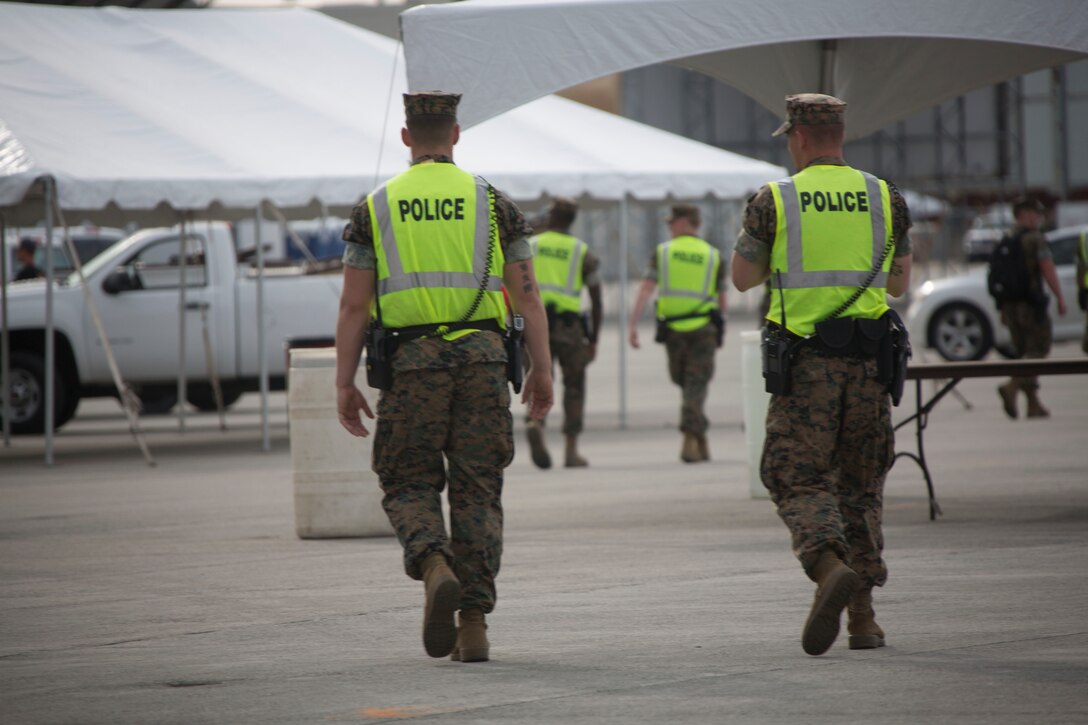 Marines with the Provost Marshal's Office provide security during the 2016 Marine Corps Air Station Cherry Point Air Show -- "Celebrating 75 Years' at MCAS Cherry Point, N.C. The air show celebrated MCAS Cherry Point and 2nd Marine Aircraft Wing’s 75th anniversaries and featured 40 static displays, 17 aerial performers and a concert.