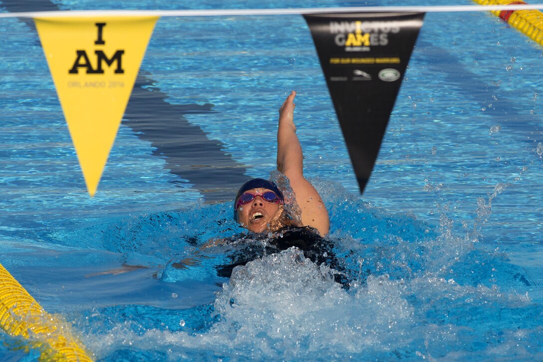 Army Staff Sgt. Ola Nahale competes in the backstroke preliminary swim competition at the 2016 Invictus Games in Orlando, Fla., May 7, 2016. DoD photo by Roger Wollenberg