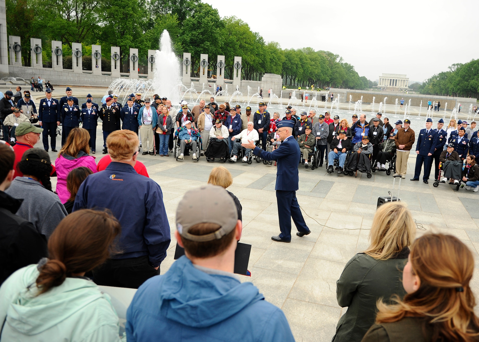 Lt. Gen. Arnold W. Bunch Jr., the military deputy for the Air Force’s assistant secretary for acquisition, speaks to the Georgia Honor Flight and onlookers at the National World War II Memorial in Washington, D.C., April 30, 2016. The Georgia Honor Flight was one of many such flights to visit the nation’s capital through the Honor Flight Network. (U.S. Air Force photo/Tech. Sgt. Bryan Franks)