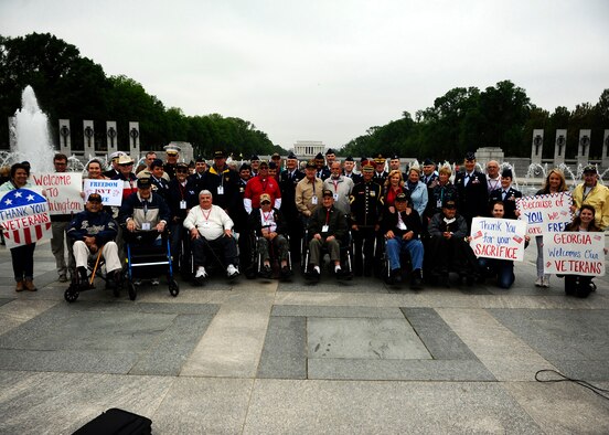 Service members and civilians thank World War II veterans for their service at the National World War II Memorial in Washington, D.C., during an Honor Flight ceremony April 30, 2016. The Honor Flight Network is a nonprofit organization dedicated to transporting America’s veterans to the nation’s capital to visit the memorials. (U.S. Air Force photo/Tech. Sgt. Bryan Franks)