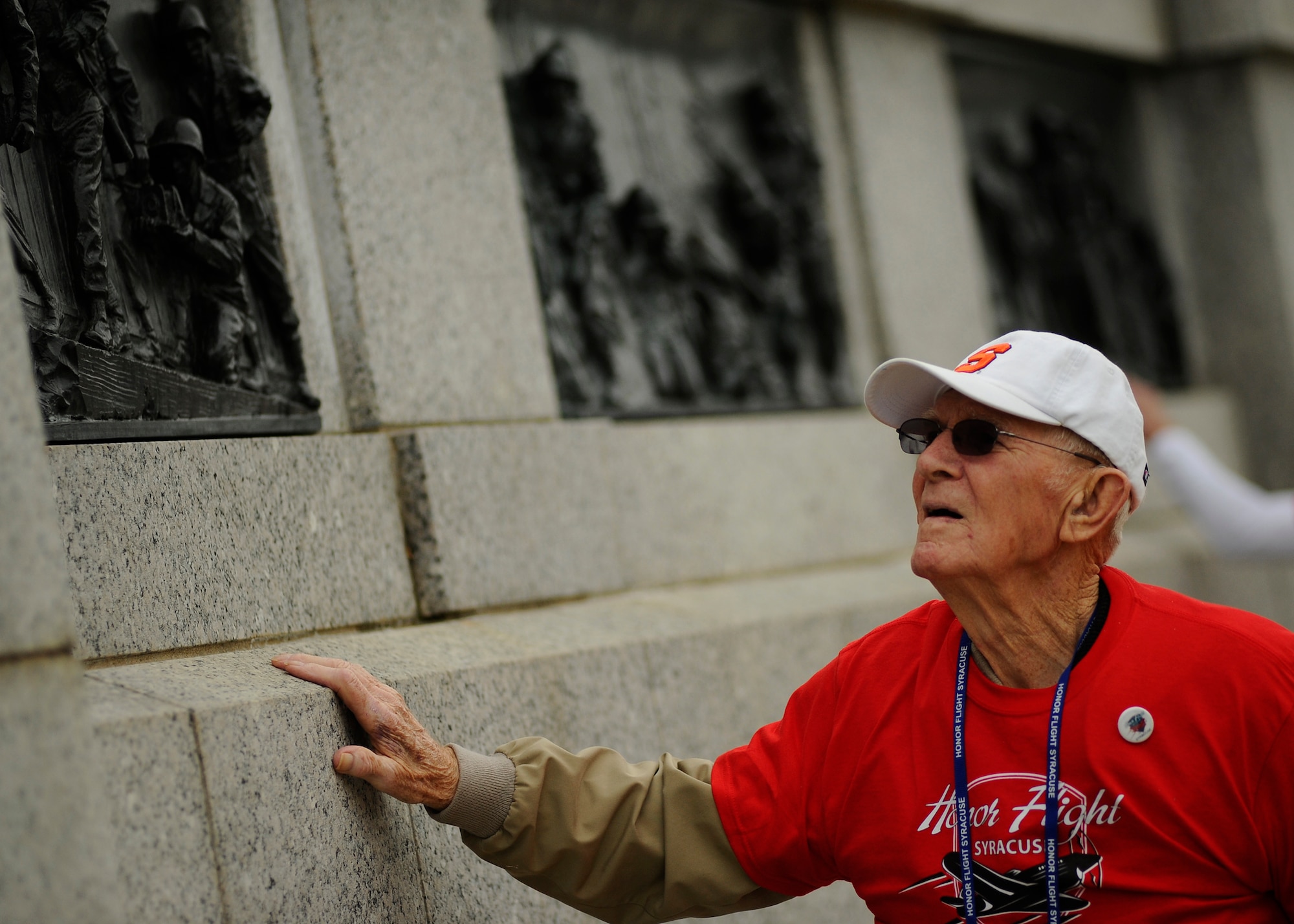 Service members and civilians thank World War II veterans for their service at the National World War II Memorial in Washington, D.C., during an Honor Flight ceremony April 30, 2016. The Honor Flight Network is a nonprofit organization dedicated to transporting America’s veterans to the nation’s capital to visit the memorials. (U.S. Air Force photo/Tech. Sgt. Bryan Franks)